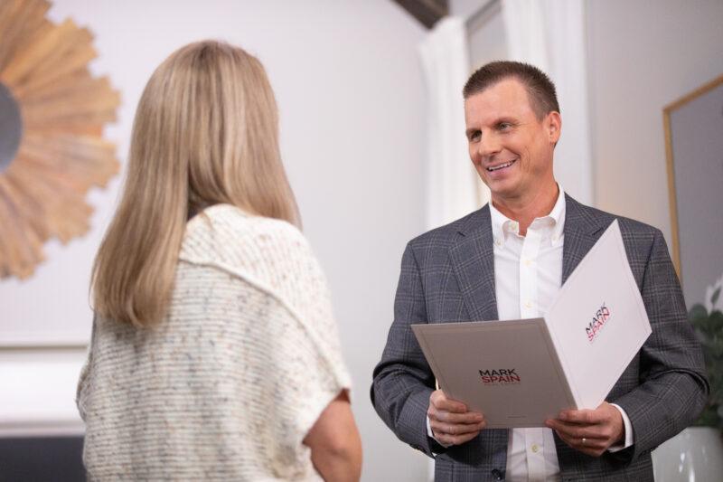 Mark Spain and Laura going over her selling options