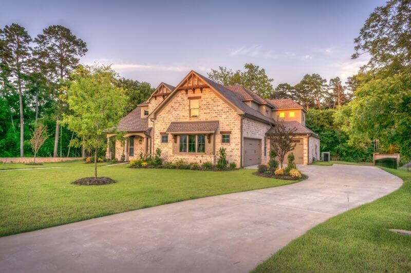One of our top summer curb appeal tips is to refinish your driveway.