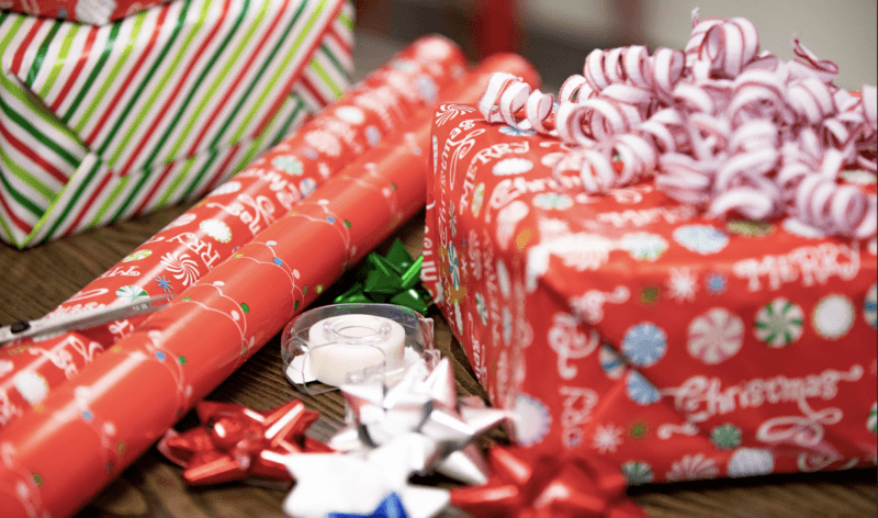 Presents being wrapped for Christmas at Mark Spain Real Estate